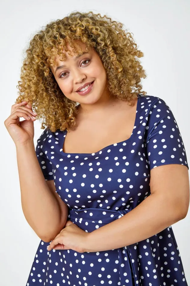 Navy Curve Stretch Polka Dot Peplum Top Women Roman Tops